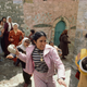 palestinian woman holding rock
